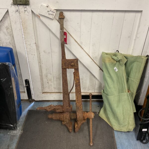 Vintage blacksmith post vice made of forged iron.