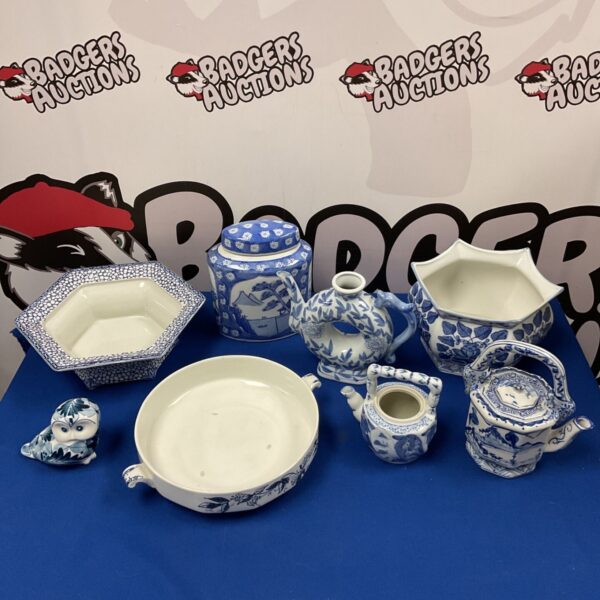 Blue and white china collection featuring a teapot, ginger jar and bowls.