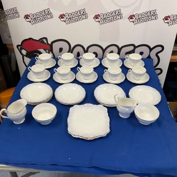Vintage blue and white fine bone china tea set on display.