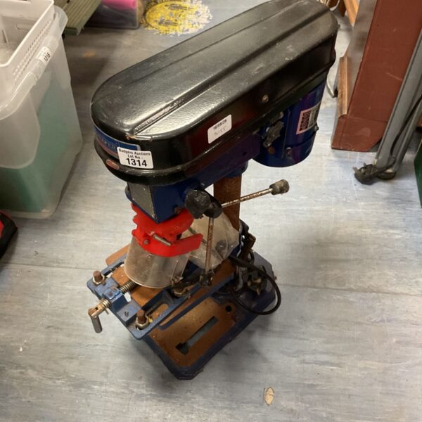 Vintage blue and black pillar drill for workshop use.