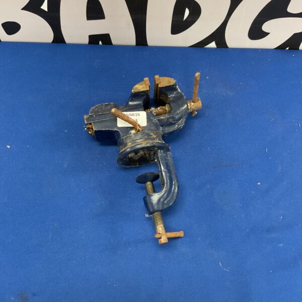 Blue cast iron portable bench vice with swivel top.
