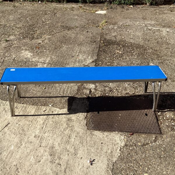 Blue folding bench with metal legs, ideal for portable seating.