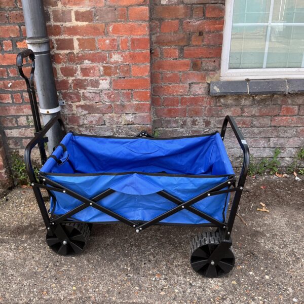 Blue folding garden cart with all-terrain wheels for garden use.