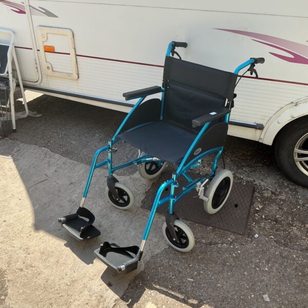 Blue folding transit wheelchair for mobility assistance.