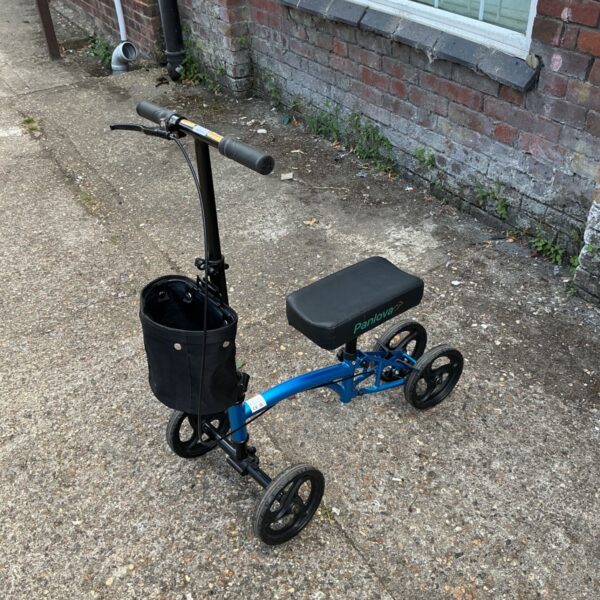 Blue knee walker with front basket for medical mobility assistance.