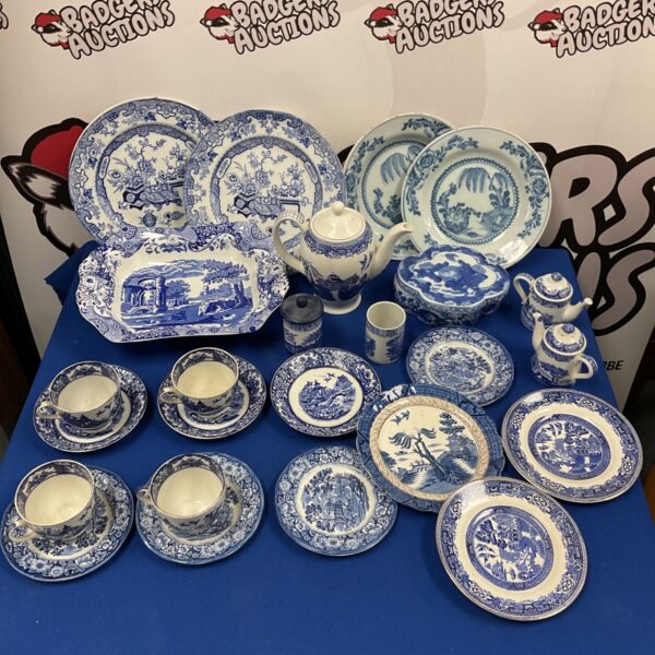 Collection of antique blue and white willow pattern china.