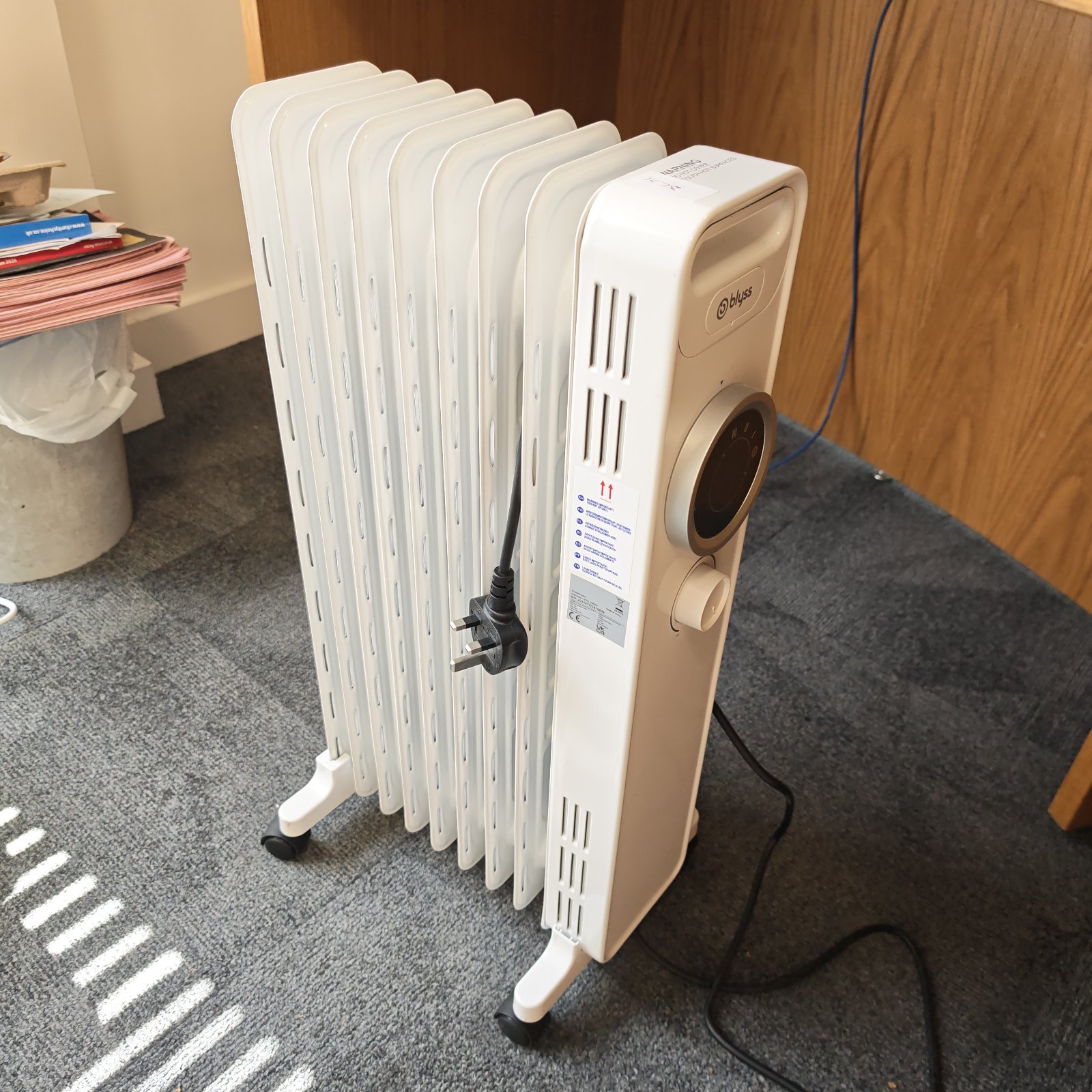 White Blyss electric heater with adjustable settings for portable warmth.