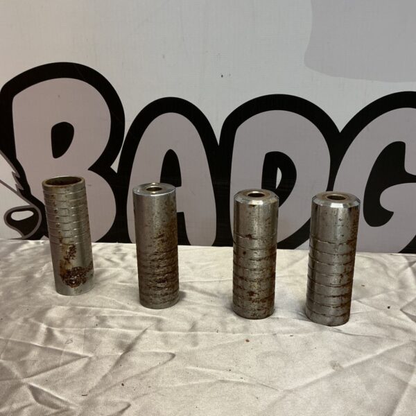 Set of four used BMX stunt pegs for bike tricks.