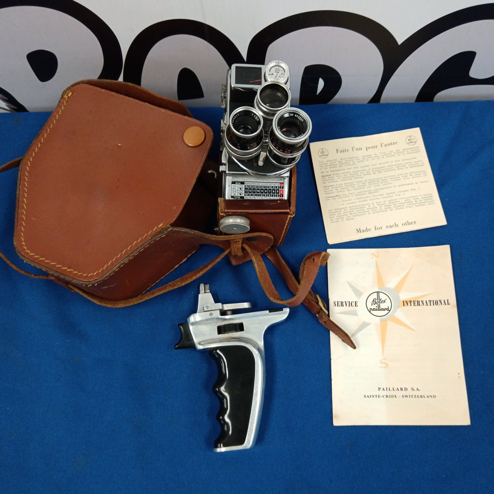 Vintage Bolex Paillard cine film camera with leather case and manual.