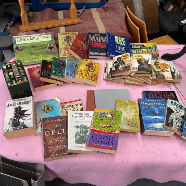 Mixed genre book lot including Sherlock Holmes and fantasy novels.