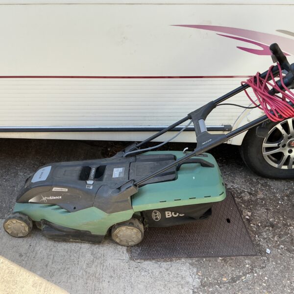 Used Bosch AdvancedRotak lawn mower with power cable visible.