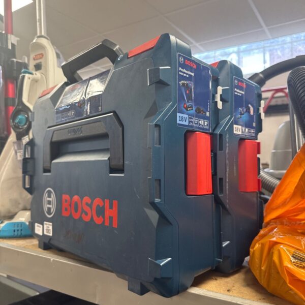 Two stacked Bosch professional tool boxes for power tool storage.