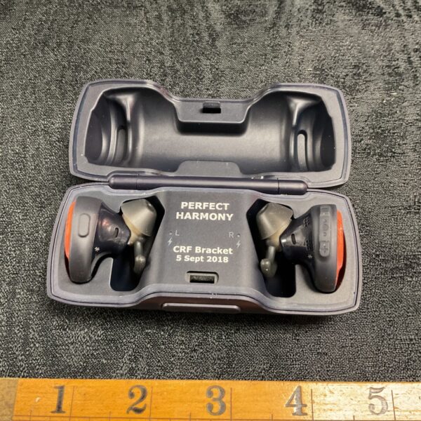 Open Bose Perfect Harmony earbud charging case with earbuds inside.