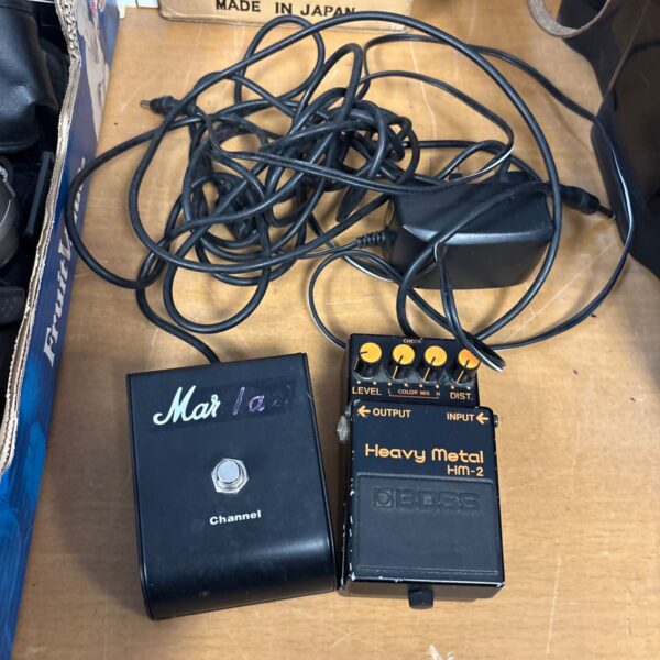 Vintage Boss HM-2 heavy metal guitar pedal with Marshall channel markings.