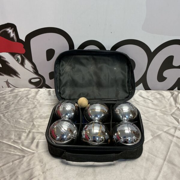 Vintage boules set in a black carrying case for outdoor lawn games.