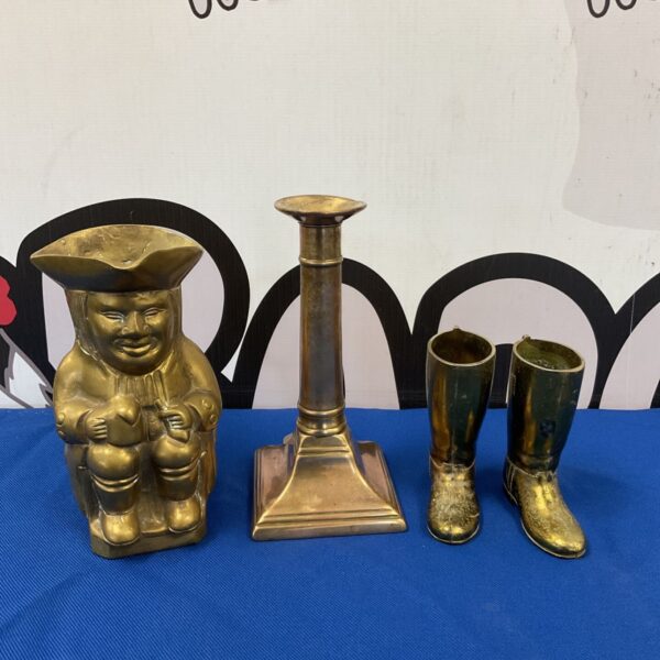 Antique brass toby jug and Georgian candlestick pair for collectors.