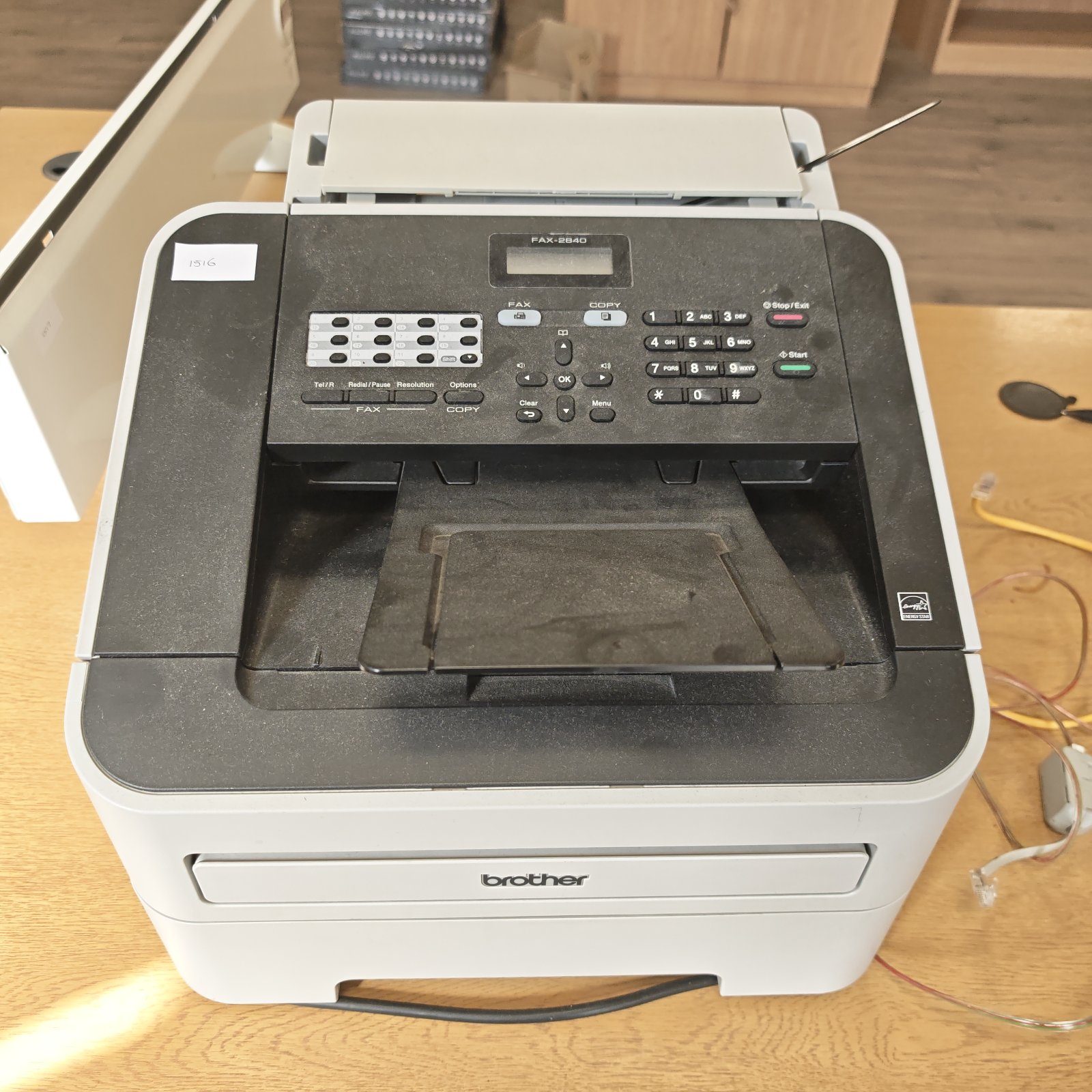 Vintage Brother fax machine model 2840, a retro office device.