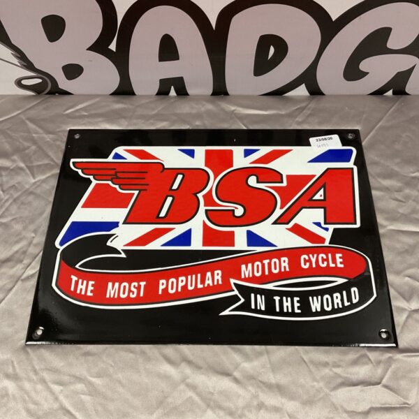 Vintage BSA enamel sign advertising motorcycles, showing wear and tear.