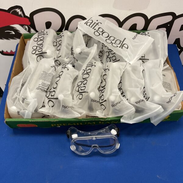 Bulk lot of individually packaged clear safety goggles for protection.