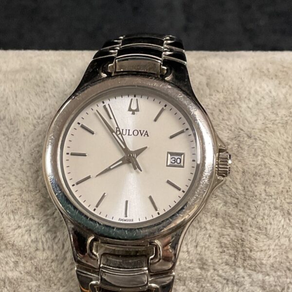 Silver tone Bulova ladies wristwatch with date display.