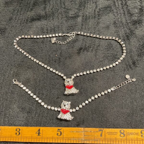 Butler and Wilson Scottie dog necklace and bracelet set on velvet.
