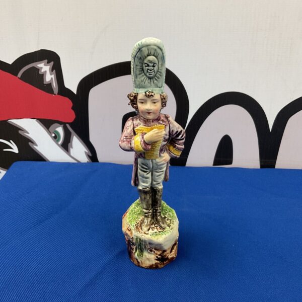 Antique Capodimonte porcelain soldier figurine with detailed uniform.