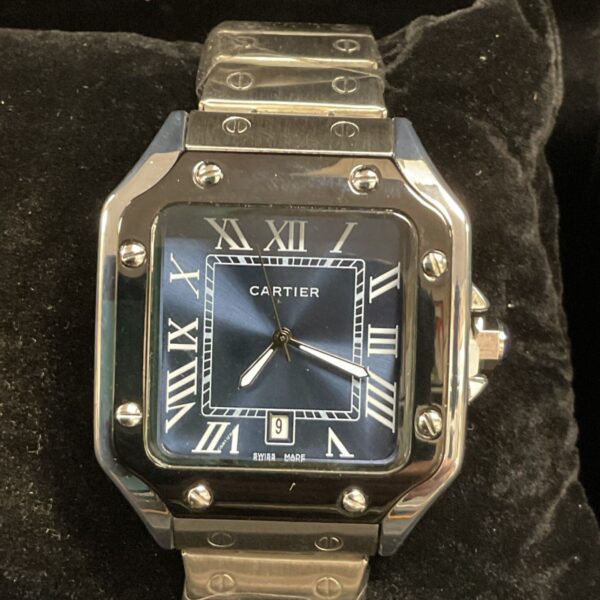 Front view of a replica Cartier stainless steel watch with blue dial.