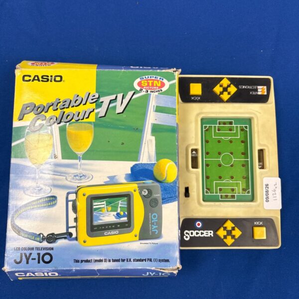 Casio JY-10 portable television in original box, vintage electronics.