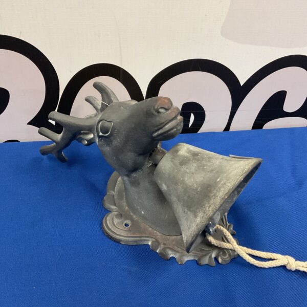 Vintage cast iron stack head bell with rope attached.