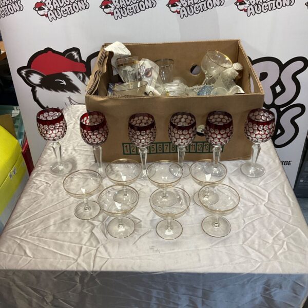 Mixed lot of champagne and wine glasses on a table.