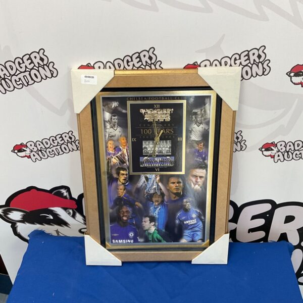 Framed Chelsea Football Club clock, a collectible sports item.