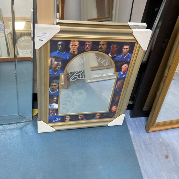 Chelsea Football Club mirror featuring player images.