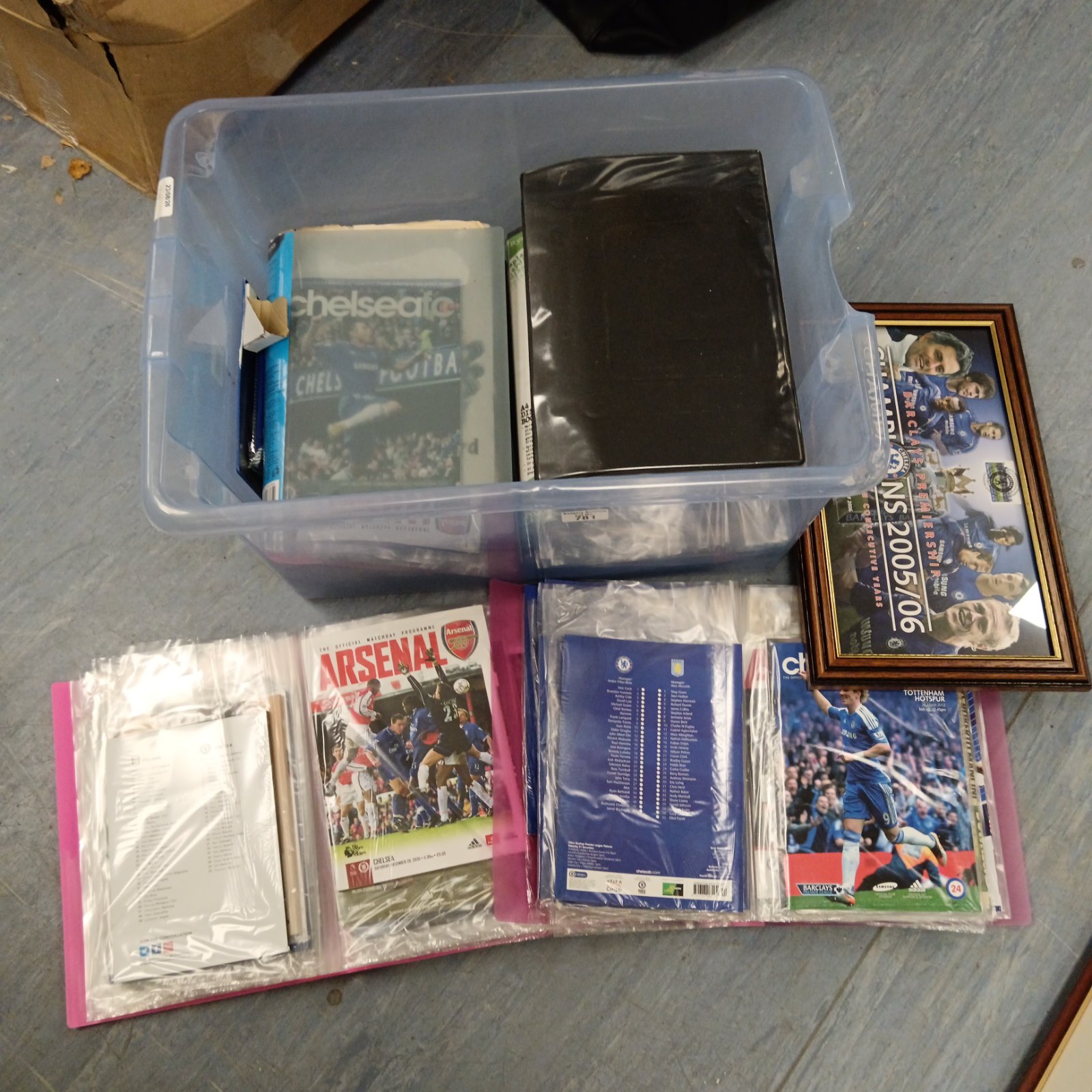 Collection of vintage Chelsea football programmes in folders.