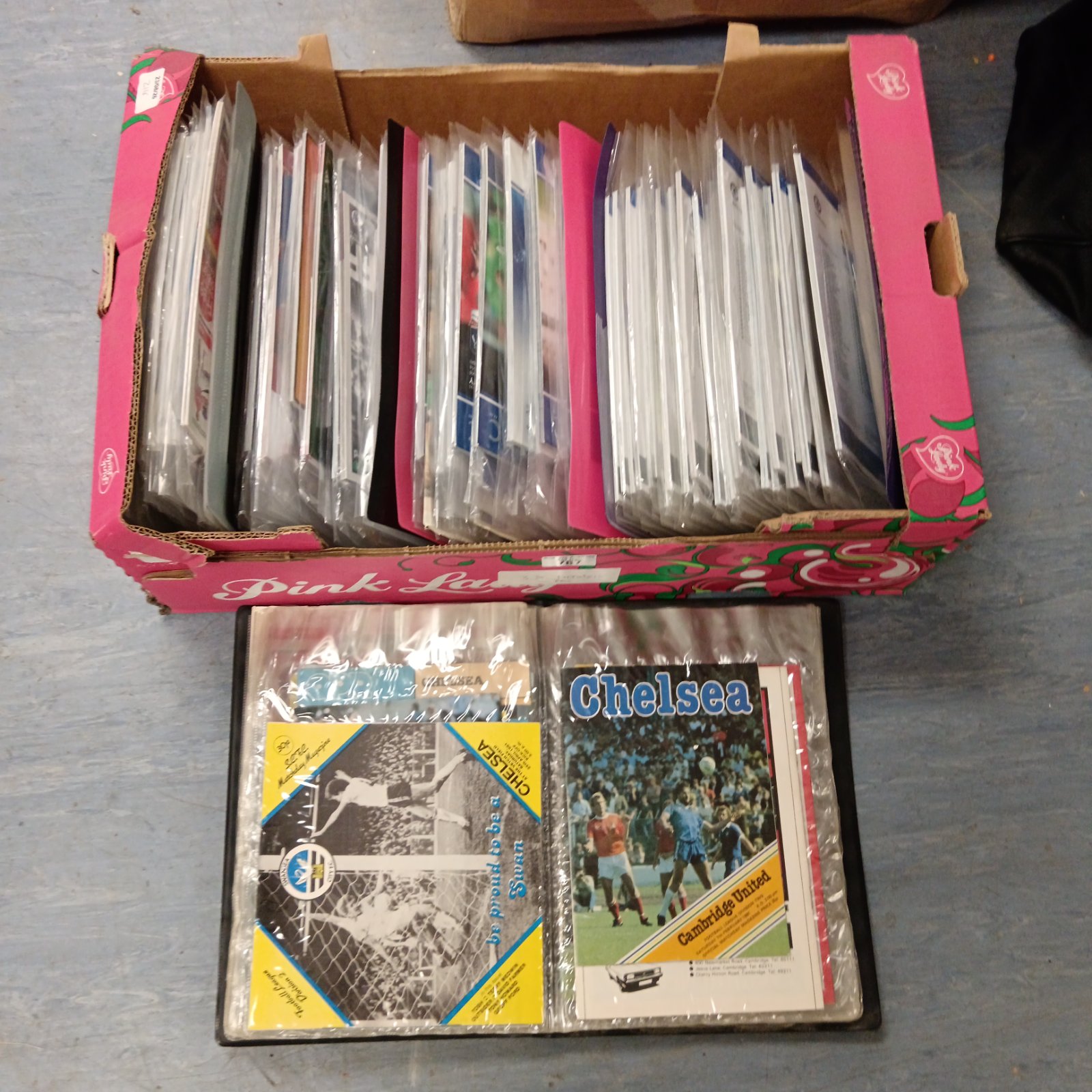 Chelsea football programmes neatly stored in folders, a vintage collection.