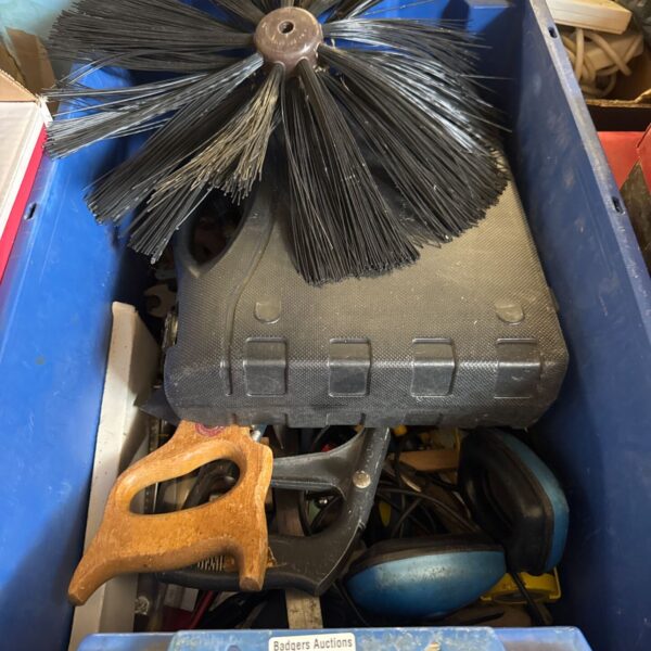 Chimney sweep brush head amongst garage clearance tools.
