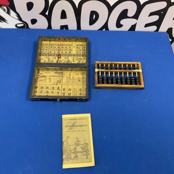 Vintage Chinese abacus set with lacquered box and arithmetic guide.