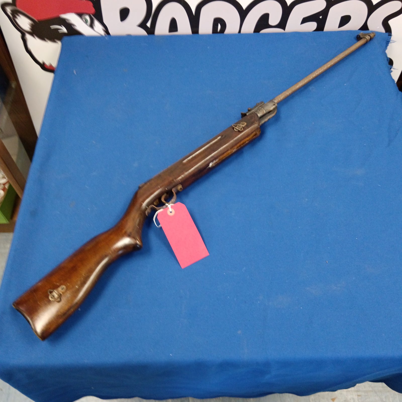 Vintage Chinese arrow air rifle with wooden stock.