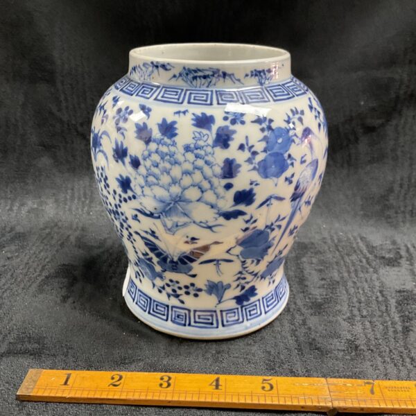 Antique 19th century Chinese blue and white porcelain jar with floral design.