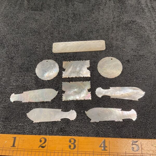 Antique Chinese mother of pearl gaming counters with hand-painted designs.