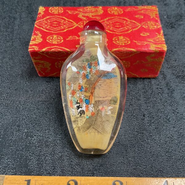 Antique Chinese scent bottle with detailed interior landscape painting.