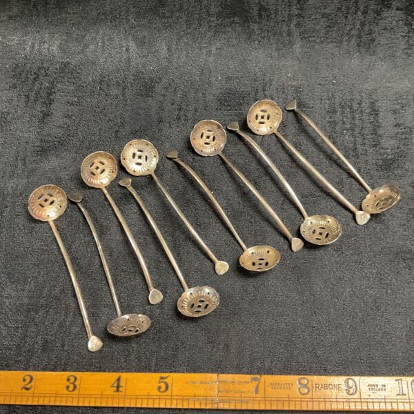 Lot of ten antique Chinese whitemetal sifter spoons.