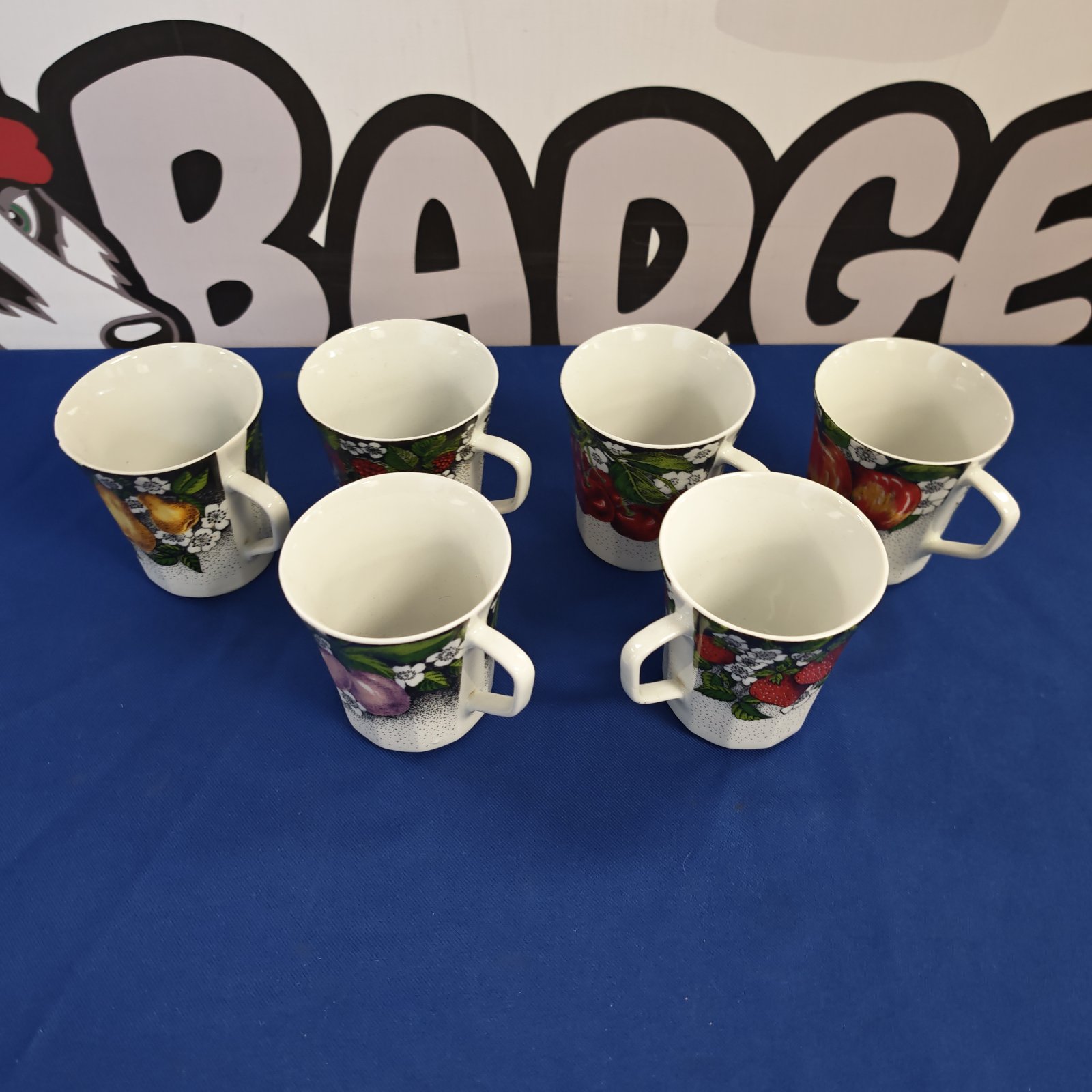 Set of six vintage Chodziez Polish tea cups with floral designs.