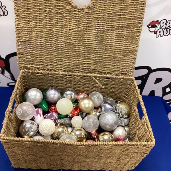 Colourful Christmas baubles displayed in a woven basket.