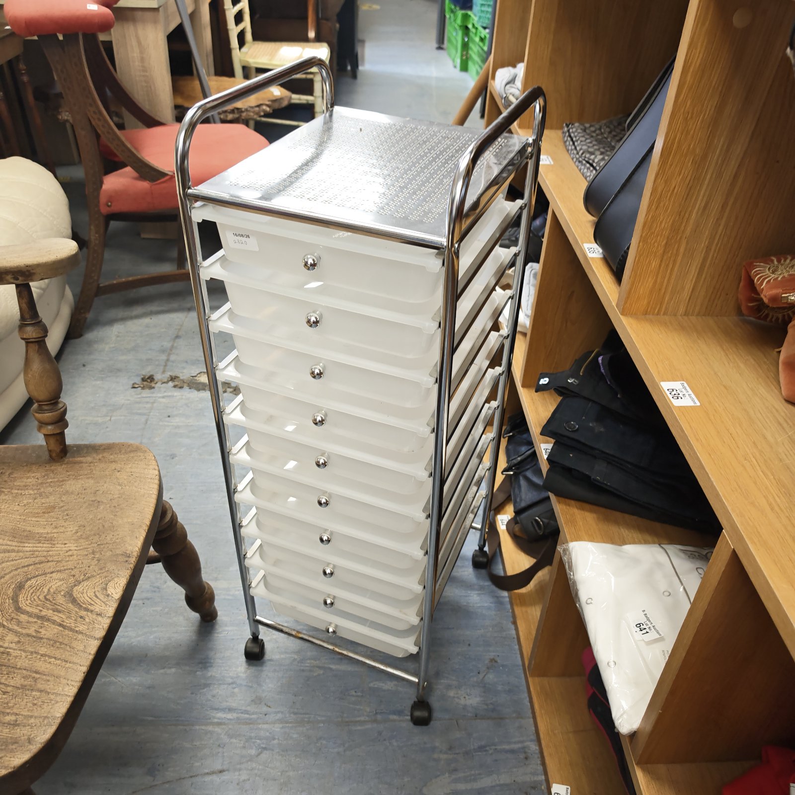 Vintage chrome and plastic wheeled storage drawers for home or office.