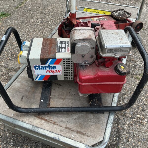 Clarke Power petrol generator with red engine and black frame.