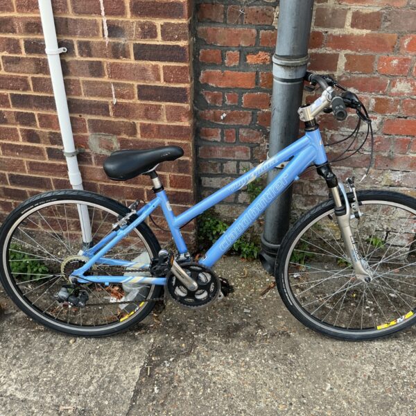 Light blue Claud Butler mountain bike with front suspension.