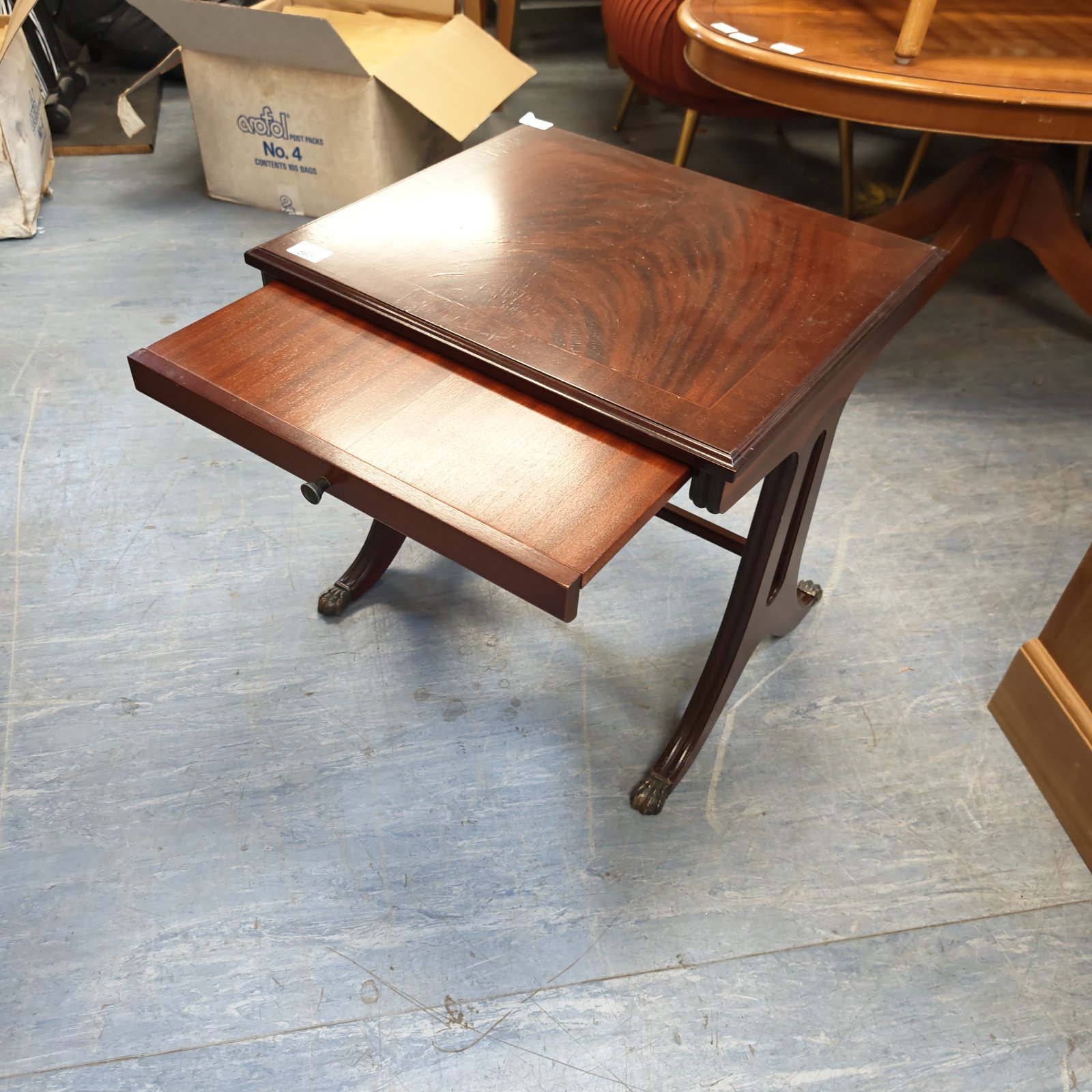 Reproduction mahogany claw foot side table with tilting top.