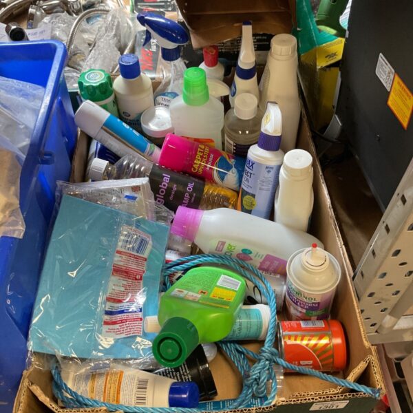 Mixed lot of cleaning supplies including spray bottles and cloths.