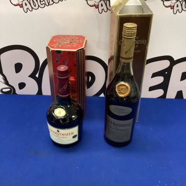 Two vintage Cognac bottles, including Hennessy, in original packaging.