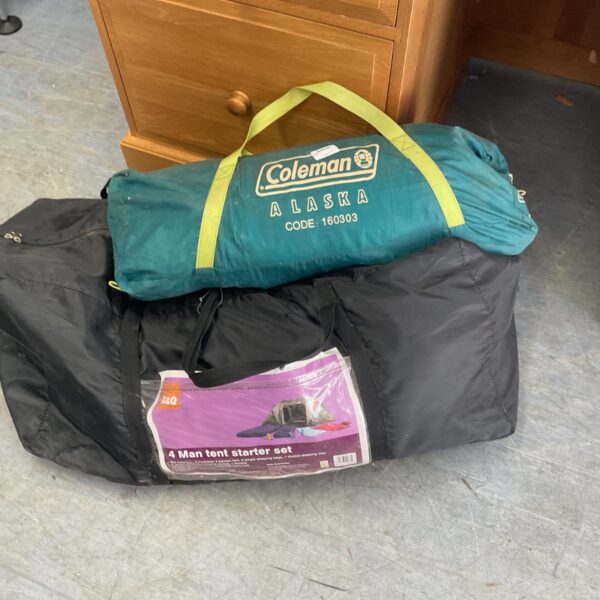 Coleman and B&Q camping tents in storage bags.